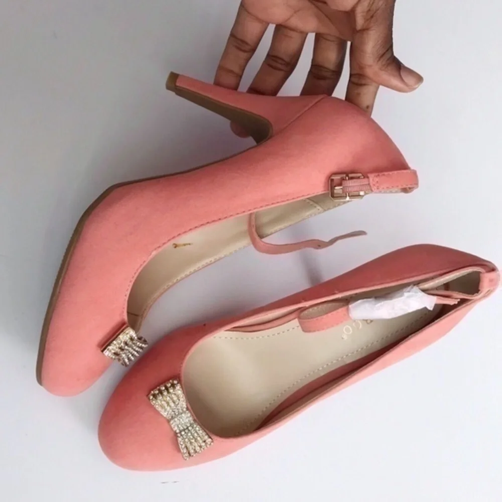 Pink faux suede bamboo heels with bow